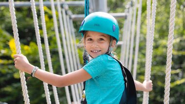 Kind das gerade im Waldseilpark-Golm klettert | © Golm Silvretta Lünersee Tourismus GmbH Bregenz, Mathaeus Gartner